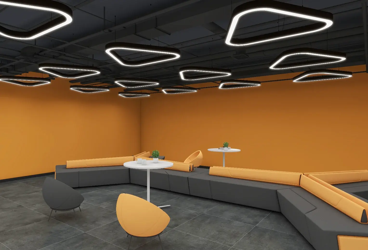 Angled four-sided S~08 ring pendants in a black-ceilinged breakout lounge with orange walls